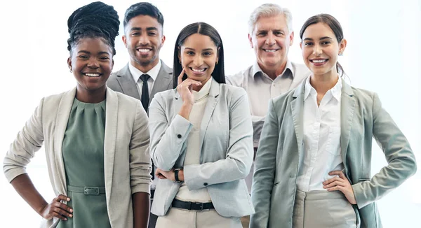 Cropped portrait of a diverse group of corporate businesspeople standing in their office.