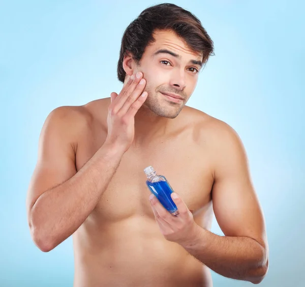 Shot Young Man Applying Cologne His Skin Studio Background — Stockfoto