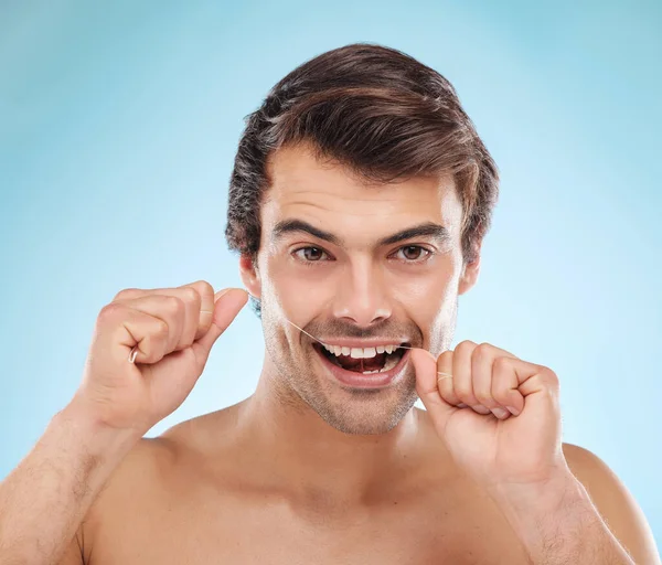 Shot Handsome Young Man Flossing His Teeth Studio Background — Foto Stock