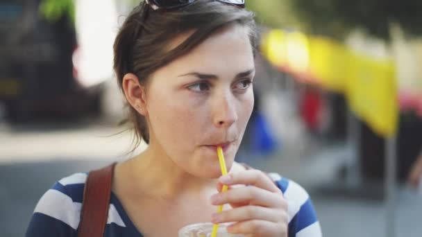 Video Footage Young Woman Enjoying Some Orange Juice While Out — Stock videók