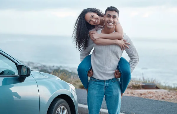 Shot of a young couple on a road trip together.