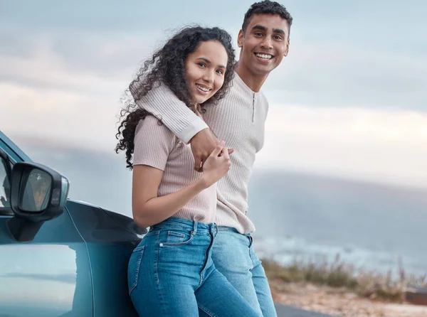 Shot of a young couple on a road trip together.