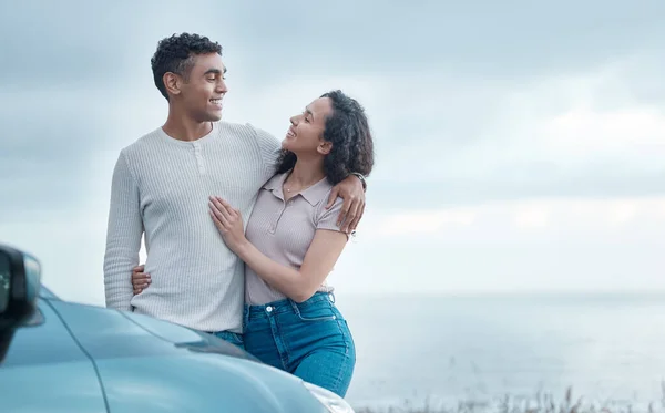 Shot of a young couple on a road trip together.