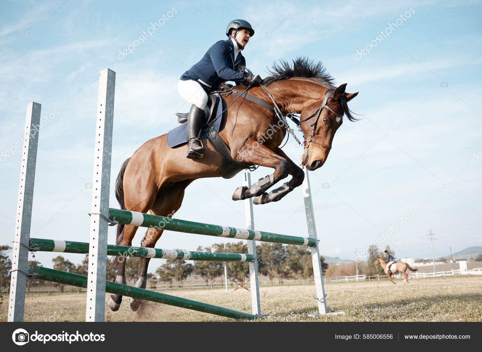 Full Length Shot Young Female Rider Jumping Hurdle Her Horse fotos, imagens  de © PeopleImages.com #585006420