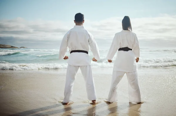 Rearview Shot Two Unrecognizable Martial Artists Practicing Karate Beach — ストック写真