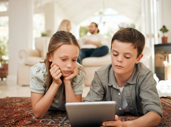 Shot Young Brother Sister Playing Together While Using Digital Tablet — Stock fotografie