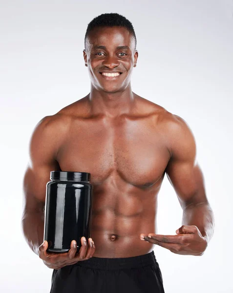 Shot Handsome Young Man Standing Alone Studio Holding Container Whey — Stock fotografie