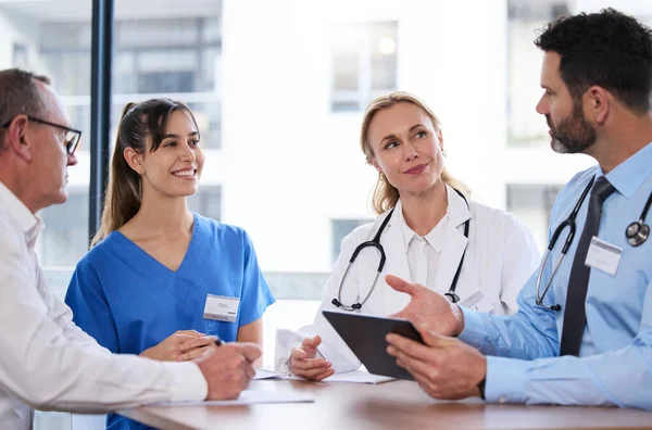 Shot of a group of doctors in a meeting at a hospital.