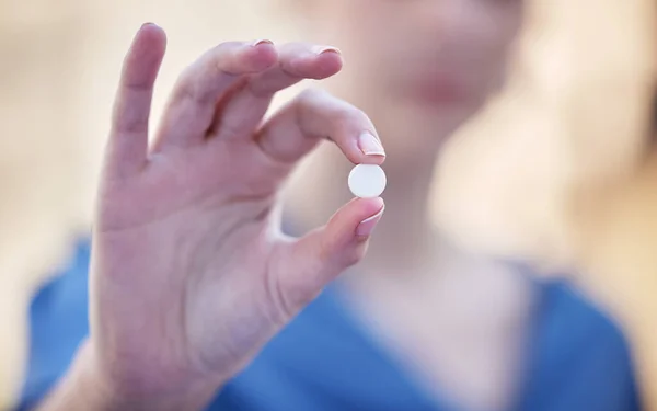 stock image Shot of a businesswoman holding a vitamin pill.