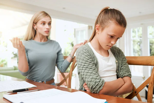 Shot Young Mother Looking Frustrated While Helping Her Daughter Homework — Stockfoto