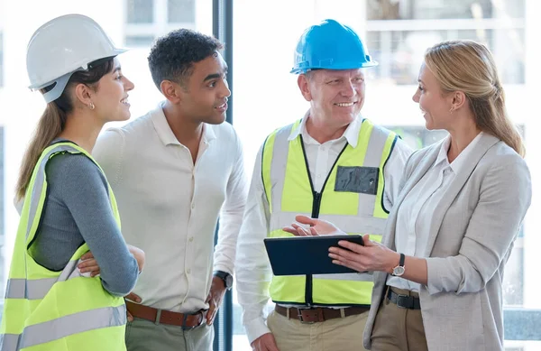 Cropped Shot Four Construction Workers Looking Tablet While Having Meeting — Photo