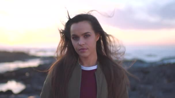 Young Woman Relaxing Beach Sunset Windy Day Her Hair Blowing — Vídeo de Stock