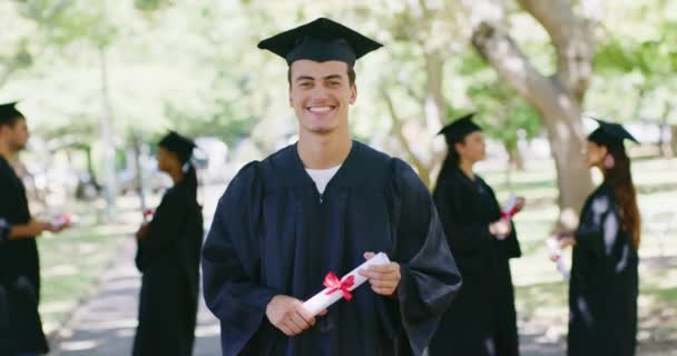Portrait University Student Graduation Ceremony Outdoors Young Man Holding Diploma — Stockvideo