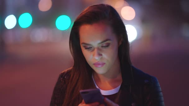 Young Woman Smiling Reading Texts Her Cellphone Night Out City — Stock Video