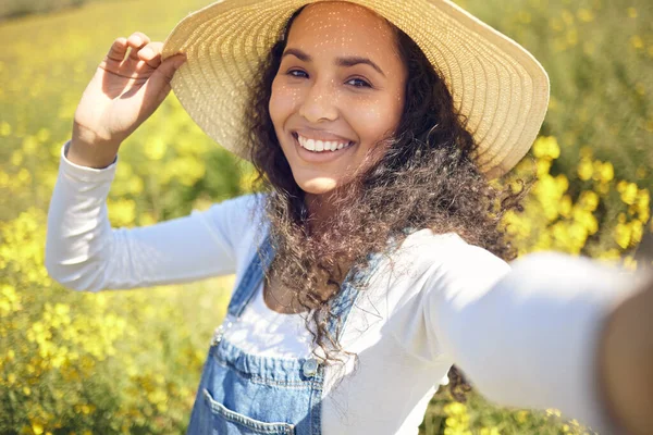 Young Woman Taking Selfie While Surrounded Yellow Flowers — Stock Fotó