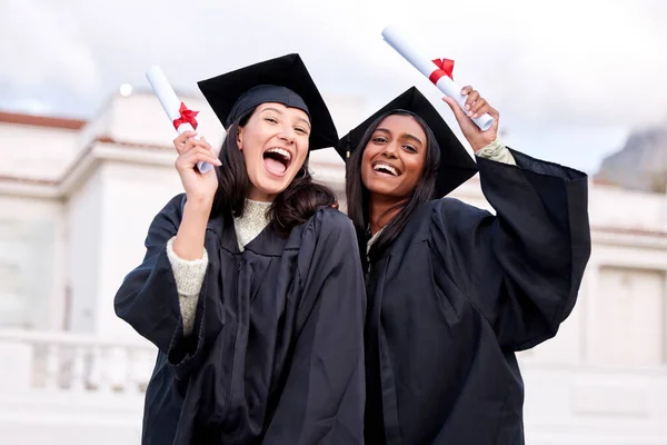 Portrait Two Young Women Celebrating Diplomas Graduation Day — Stok fotoğraf
