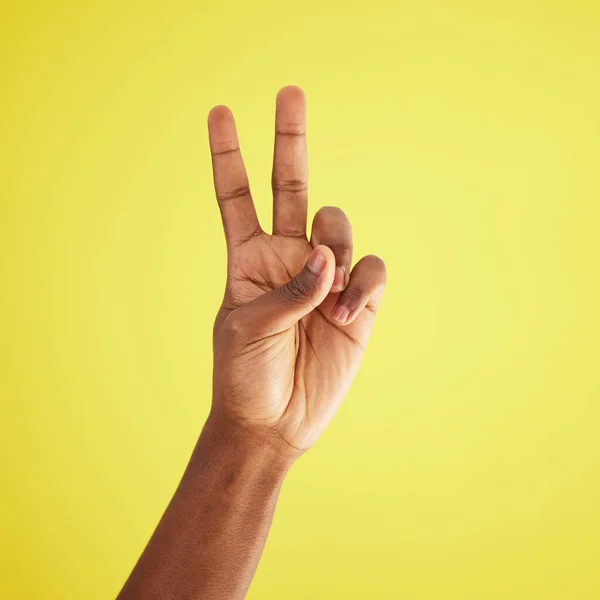 Studio Shot Unrecognisable Man Making Peace Sign Yellow Background —  Fotos de Stock