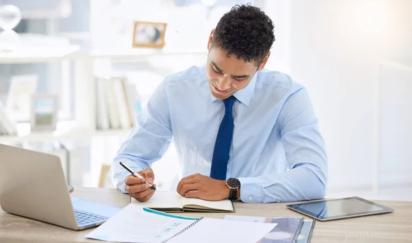 Young Businessman Working His Desk Writing His Planner — Stockfoto