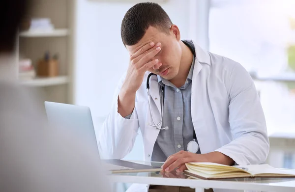 Young Doctor Sitting Alone His Clinic Feeling Stressed While Using — Stockfoto