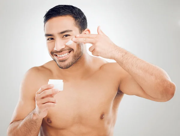 Studio Shot Handsome Young Man Applying Moisturiser Grey Background — 图库照片