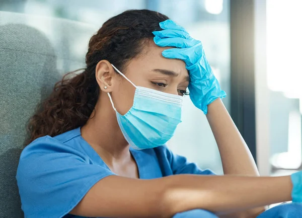 Female Nurse Looking Stressed While Sitting Hospital — 图库照片