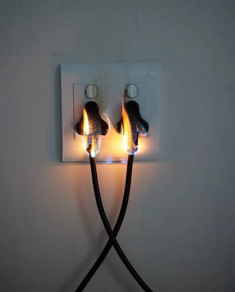 Two Plugs Wall Socket Catching Fire — Stockfoto