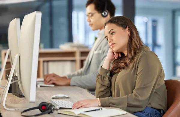 Young Call Centre Agent Looking Bored While Working Office Alongside — Stockfoto