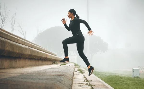 Sporty Young Woman Running Steps Outdoors — Stockfoto