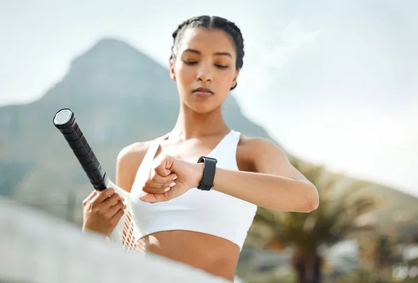 Sporty Young Woman Checking Time While Playing Tennis Outdoors — Stok fotoğraf