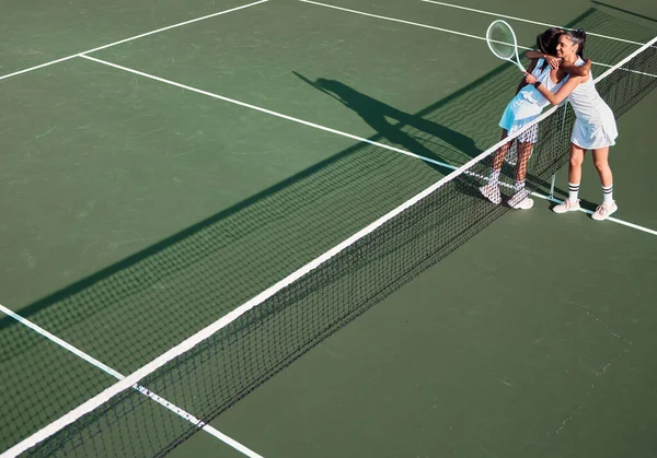 Two Sporty Young Women Hugging Each Other While Playing Tennis — 스톡 사진