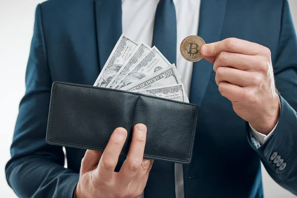 Closeup Shot Unrecognisable Businessman Holding Bitcoin Wallet Filled Banknotes White — 图库照片