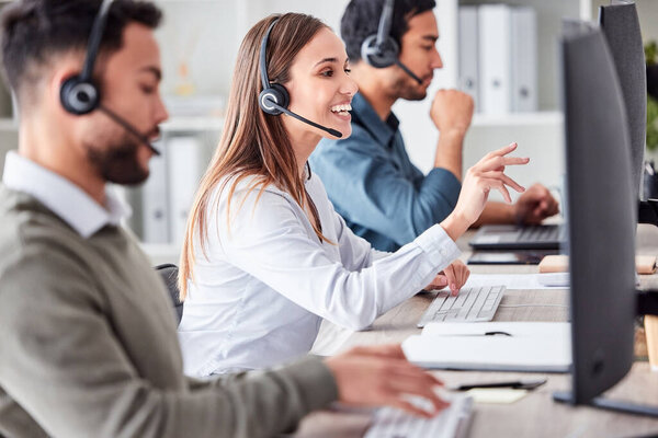 an attractive young female call center agent working in her office.