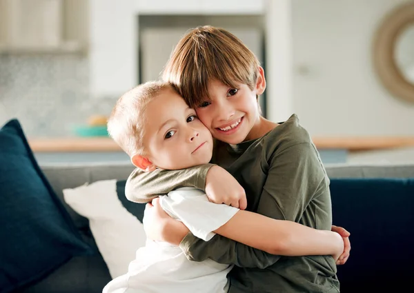 Two Little Brothers Hugging Each Other Couch Home — Stockfoto