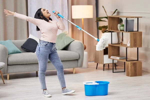 Young Woman Singing While Mopping Floors Home — Stok fotoğraf