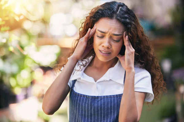 Young Female Nursery Owner Experiencing Headache Work — Stockfoto