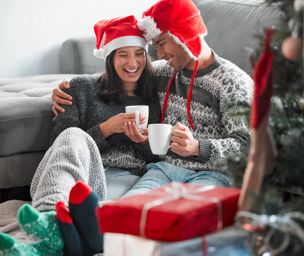 Young Couple Drinking Coffee While Celebrating Christmas Home — Stok fotoğraf