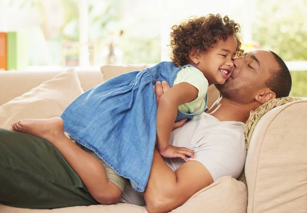 Handsome Young Man Lying Sofa Home Bonding His Daughter — Stockfoto