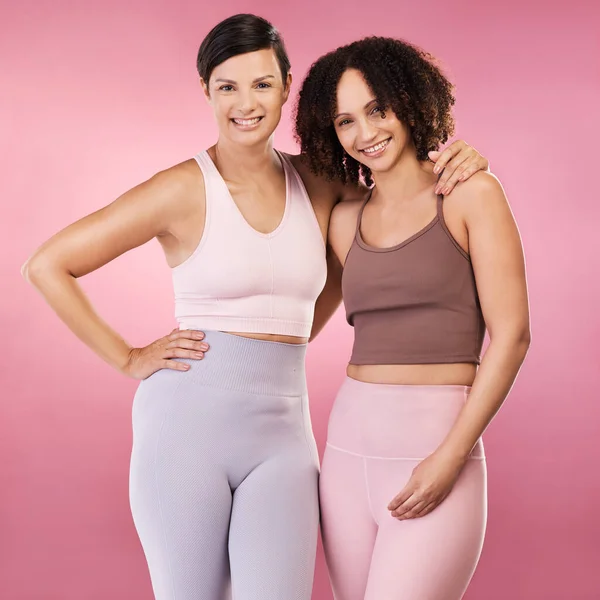 Cropped Portrait Two Attractive Young Female Athletes Posing Studio Pink — Stockfoto