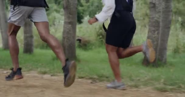 Closeup Two Athletes Running Jogging Exercise Park Outdoors Back Legs — Stockvideo