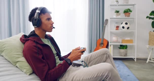 Young Gamer Playing Console Video Game Talking Wireless Headset While — Vídeos de Stock