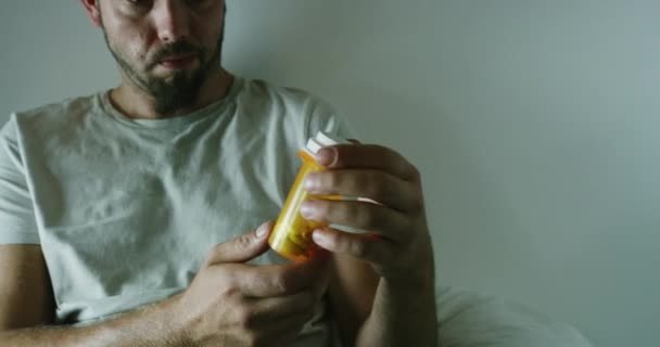 Mentally Ill Man Holding Pills Asylum Thinking Anxious Unsure Man — Stockvideo