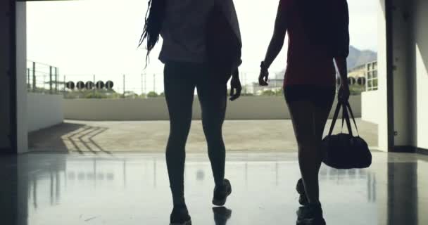 Rear View Two Young Female Athletes Walking Exercise Together Stadium — Stockvideo