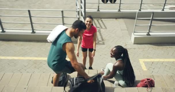 Three Active People Taking Break Stairs Young Diverse Friends Relaxing — Stockvideo