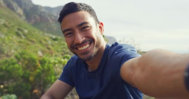 Portrait Happy Man Hiking Pointing Scenic Views While Taking Selfies — Stock Video