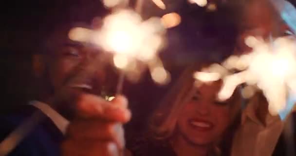 Young Diverse Friend Group Happy Smiling Carefree Holding Sparkler Night — 图库视频影像