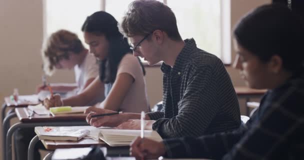 Video Footage Teenage Boy Looking Stressed While Writing His Desk — 图库视频影像