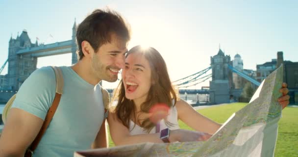 Happy Young Couple Looking Map While Holiday — Stockvideo