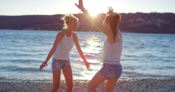 Video Footage Two Friends Playfully Waving Arms While Beach France — Stock videók