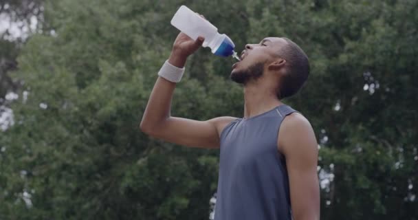 Fit Young Man Drinking Water Wiping His Sweat Intense Workout — Stockvideo