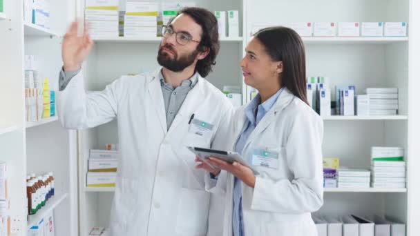 Pharmacists Working Together Stocktaking Medication Pharmacy Two Healthcare Professionals Discussing — Vídeo de stock